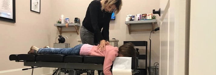 Chiropractor Houston TX Veronica Claudia Kusnir Adjusting Patient